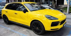 Yellow Porsche Cayenne SUV
